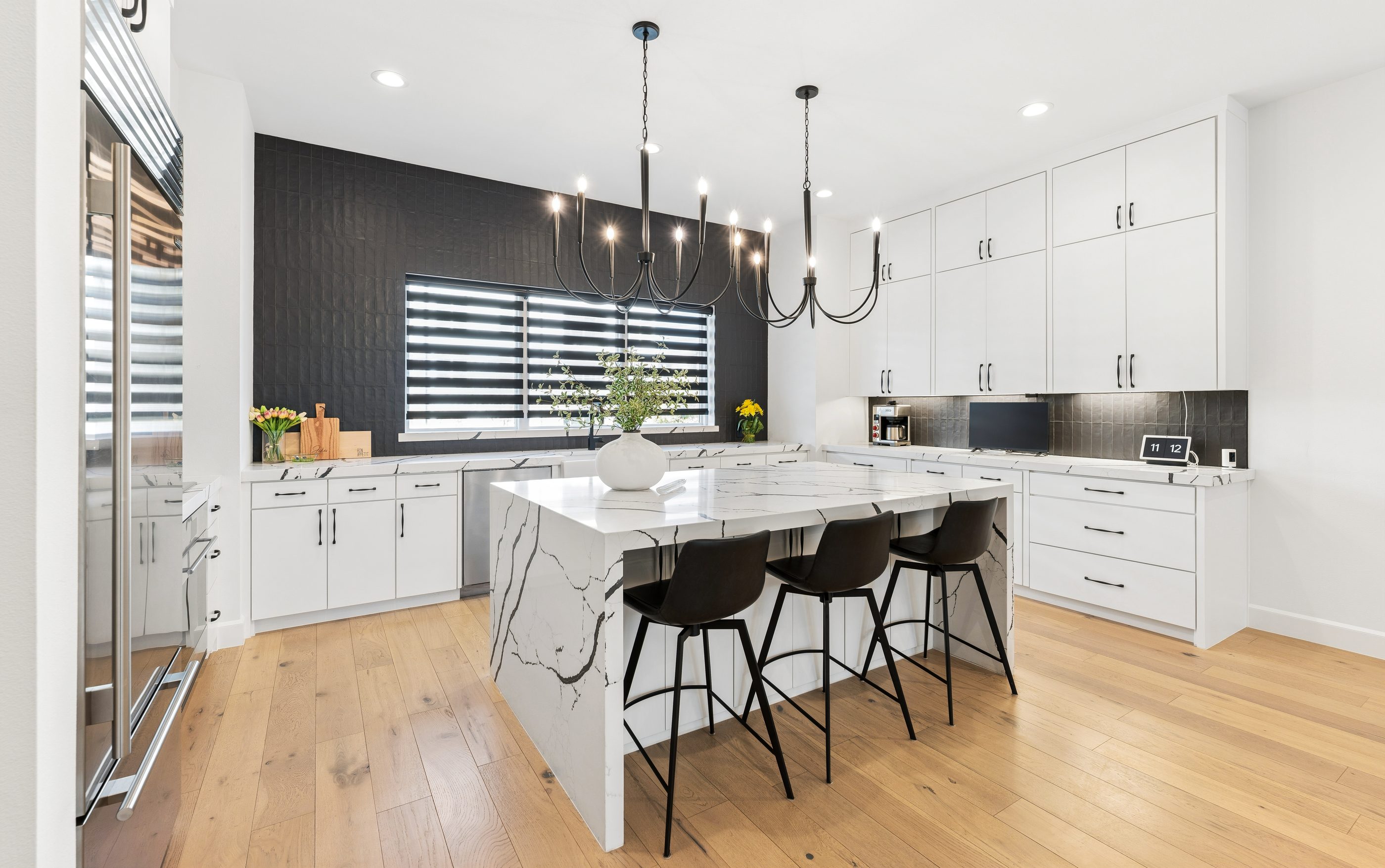 Chef's kitchen with waterfall quartz island