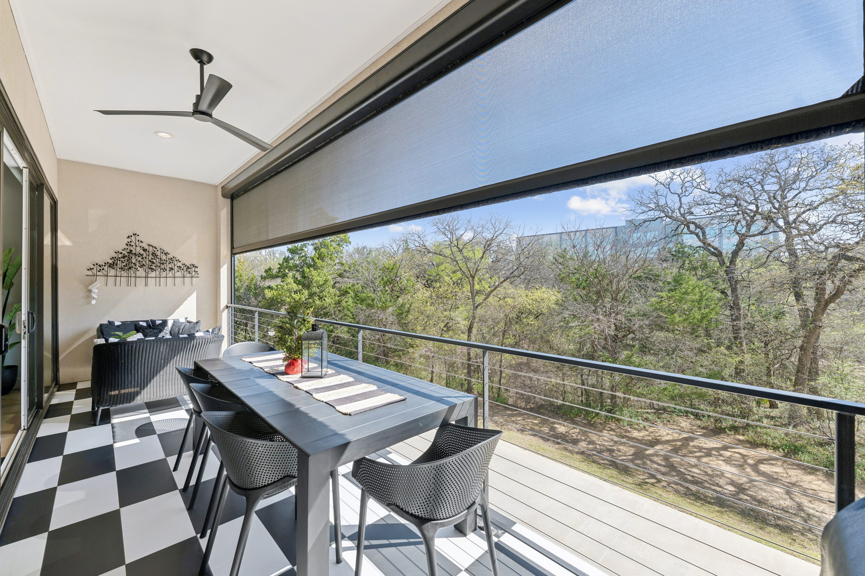 Private terrace with motorized screens and forest views